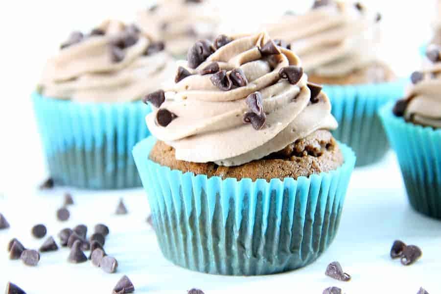 These Double Chocolate Cupcakes are filled with bits of chocolate on the inside and topped with a creamy chocolate frosting! Double Chocolate Cupcakes in blue liners