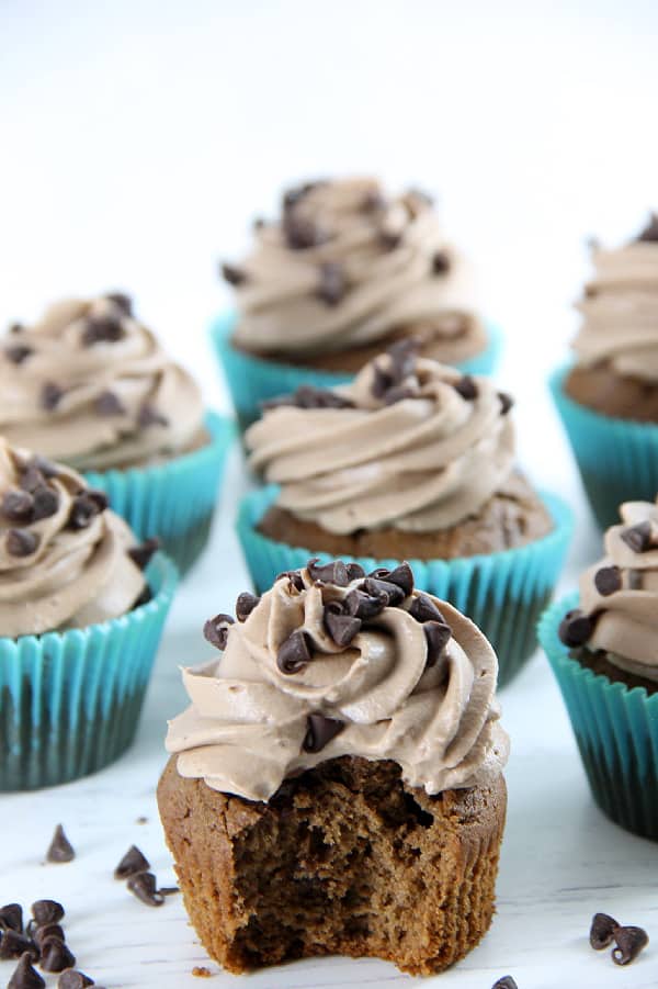 These Double Chocolate Cupcakes are filled with bits of chocolate on the inside and topped with a creamy chocolate frosting! Double Chocolate Cupcakes on white background