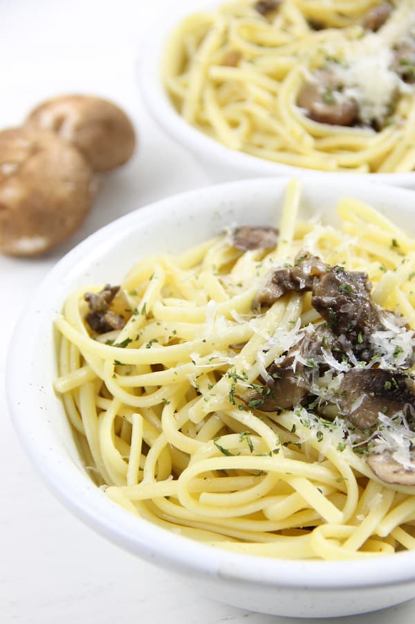 This Mushroom Pasta is one quick and easy vegetarian dinner. You'll make it a few times a week! Made with a few simple ingredients! Mushroom Pasta in white bowl
