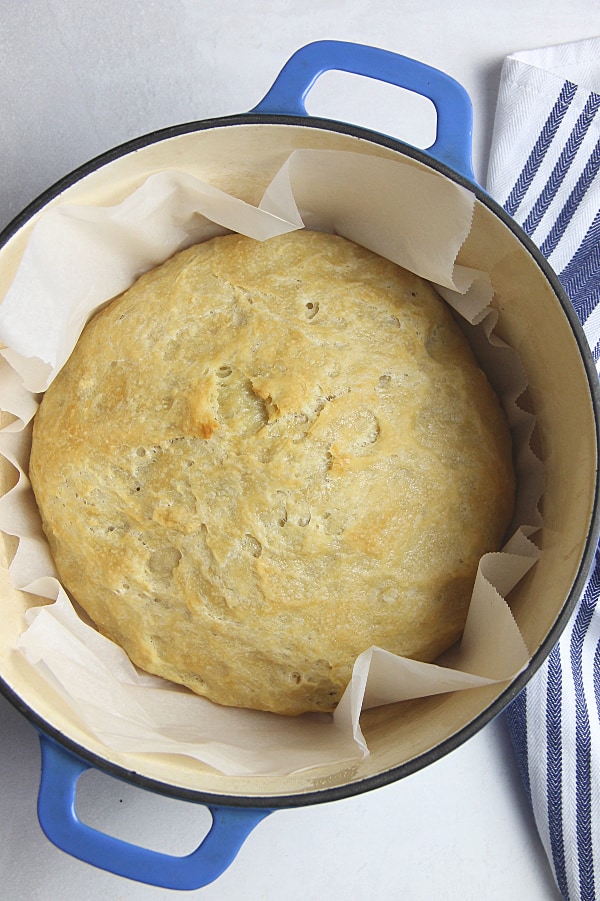 This Homemade Italian Bread is super easy to make with only 6 ingredients and very little time kneading it! Baked up in the oven for a perfect crispy bread! Homemade Italian Bread in blue dutch oven