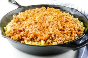 Cheesy Macaroni Pasta Bake with meat sauce on top
