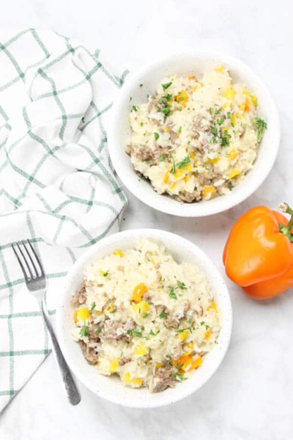 This Instant Pot Sausage and Peppers Risotto is perfect for a quick meal! Filled with Italian sausage and colorful peppers! Instant Pot Sausage and Peppers Risotto overhead view in bowl