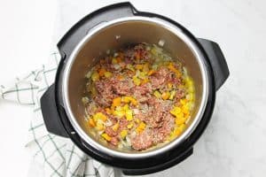 Instant Pot Sausage and Peppers Risotto with sausage in pot
