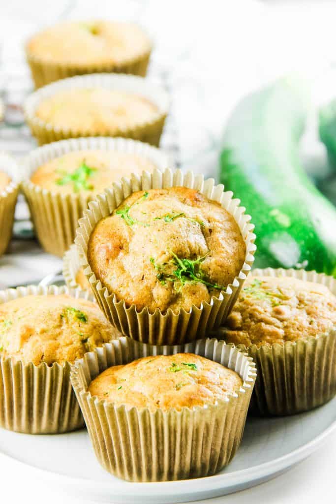 Easy Zucchini Oatmeal Muffins packed with shredded zucchini! Moist and flavorful with oats and zucchini. Perfect for hearty breakfast! Zucchini Oatmeal Muffins on plate