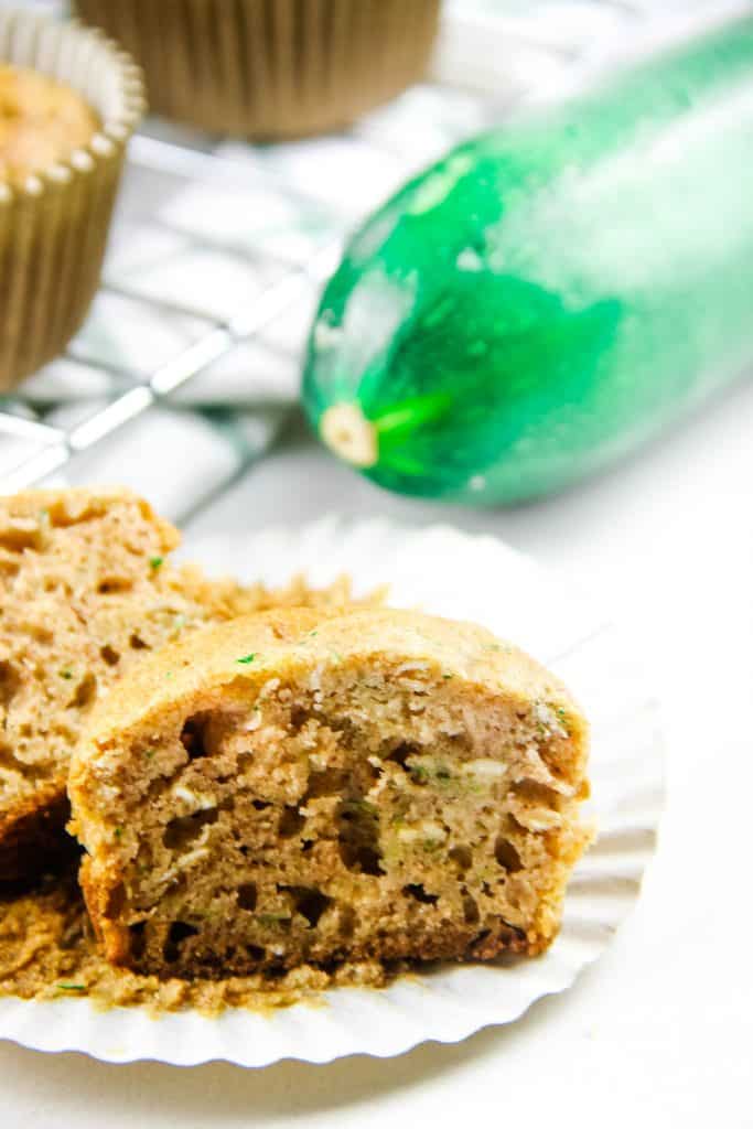 Zucchini Oatmeal Muffins cut open on liner