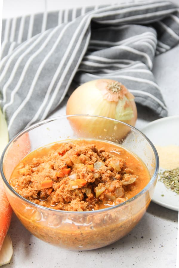 Easy Instant Pot Turkey Ragù! Made with ground turkey, herbs and tomato sauce this pasta sauce comes together quickly with the instant pot! Instant Pot Turkey Ragu in glass bowl