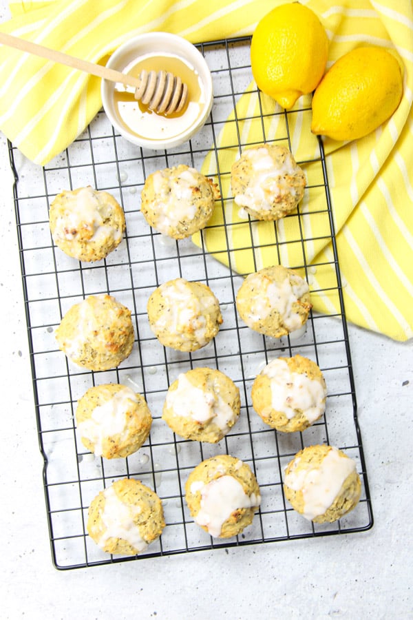Easy Lemon Chia Muffins! Full of tangy, lemony flavor loaded with chia seeds for the perfect way to start the day! Packed with protein! Lemon Chia Muffins on black cooking rack