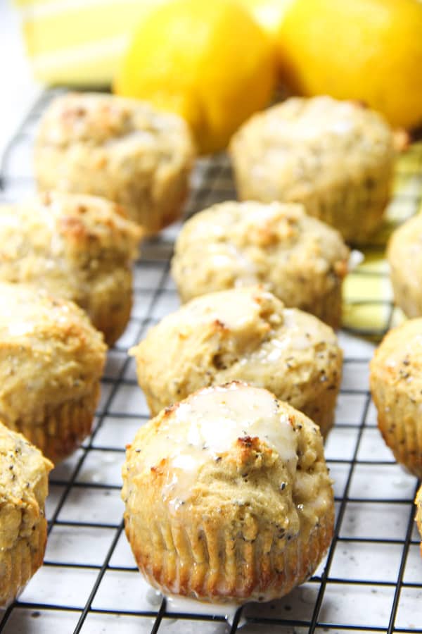 Easy Lemon Chia Muffins! Full of tangy, lemony flavor loaded with chia seeds for the perfect way to start the day! Packed with protein! Lemon Chia Muffins with glaze on top