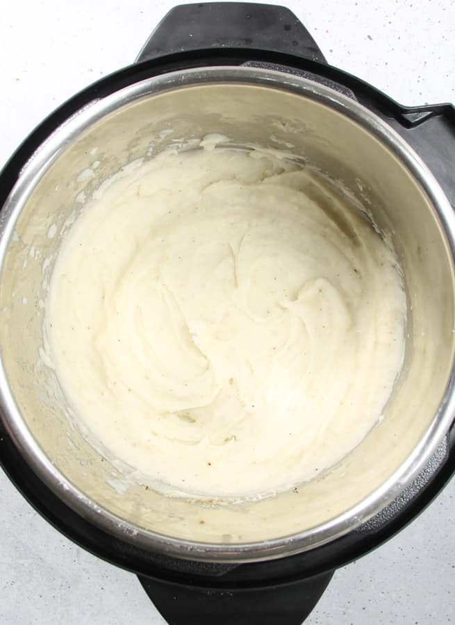 Pressure Cooker Mashed Potatoes with Gravy is an easy side dish! With creamy potatoes and a white gravy, it's ready in no time! Pressure Cooker Potatoes with Gravy cooked in pressure cooker