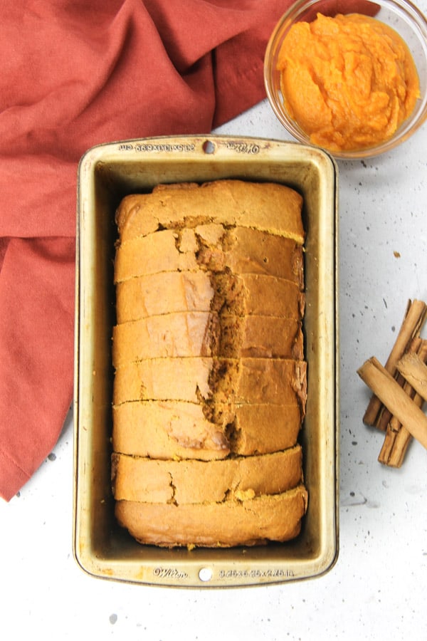 This Easy Pumpkin Bread is the perfect moist, quick bread! It's made with canned pumpkin, cinnamon, ginger and nutmeg! Pumpkin Bread in loaf pan