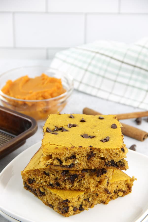 Chocolate Chip Pumpkin Sheet Pan Pancakes! A quick and easy way to make boxed pancake mix with the added ingredient of pumpkin! Chocolate Chip Pumpkin Sheet Pan Pancakes on white plate