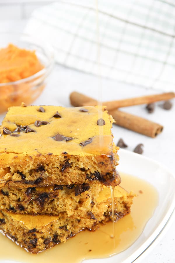 Chocolate Chip Pumpkin Sheet Pan Pancakes! A quick and easy way to make boxed pancake mix with the added ingredient of pumpkin! Chocolate Chip Pumpkin Sheet Pan Pancakes with syrup