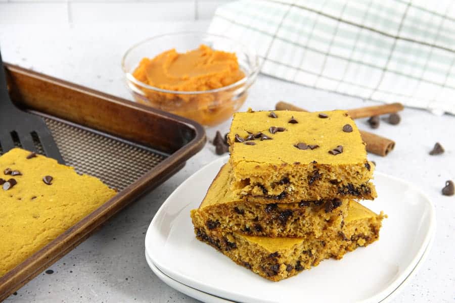 Chocolate Chip Pumpkin Sheet Pan Pancakes! A quick and easy way to make boxed pancake mix with the added ingredient of pumpkin! Chocolate Chip Pumpkin Sheet Pan Pancakes on white plate