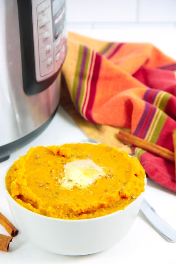 Easy Instant Pot Mashed Sweet Potatoes with Cinnamon! Creamy potatoes flavored with cinnamon, nutmeg and butter! The BEST side dish! Instant Pot Mashed Sweet Potatoes with Cinnamon with instant pot and napkin