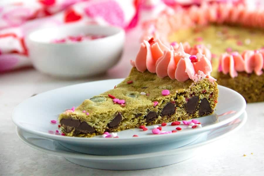 This easy, rich, and chewy Dark Chocolate Cookie Cake is the perfect treat for Valentine's Day! Bakes up in 15 minutes! Dark Chocolate Cookie Cake on white plate