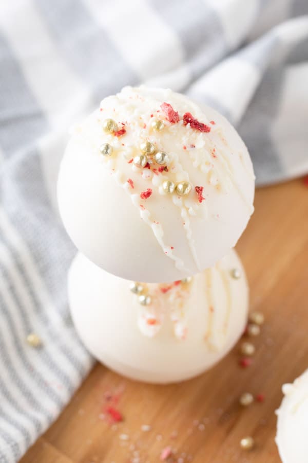 These Strawberry Hot Cocoa Bombs are the perfect sweet treat! So fun for Valentine's day or any day of the week bombs stacked on each other
