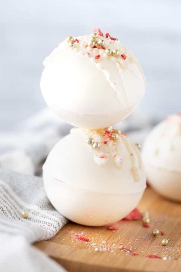 These Strawberry Hot Cocoa Bombs are the perfect sweet treat! So fun for Valentine's day or any day of the week bombs stacked on each other
