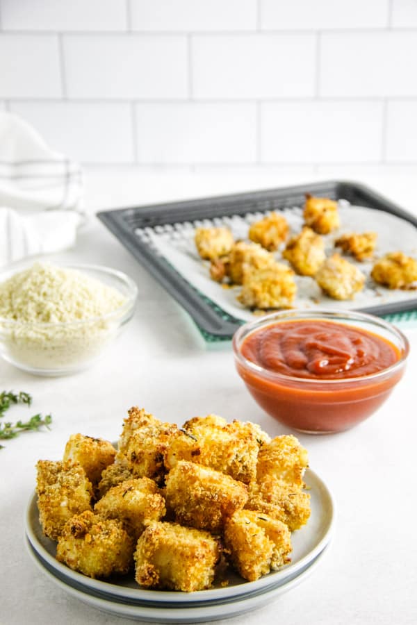 Air Fryer Fish Nuggets are crispy on the outside and cooked perfectly on the inside! Made with cod, panko and herbs. air fryer fish nuggets on plate.