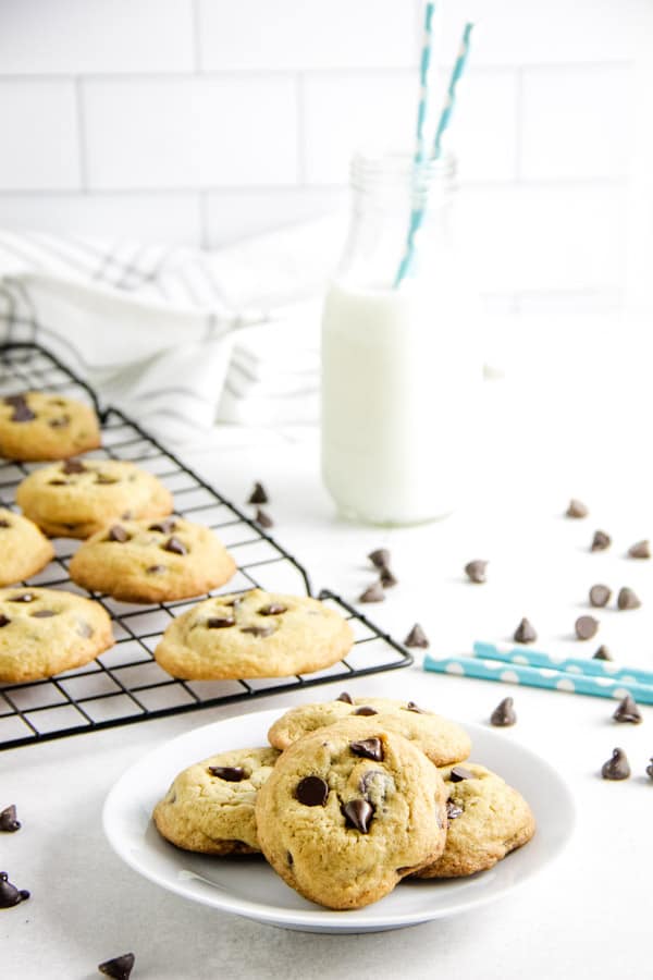 With simple ingredients these Classic Chocolate Chip Cookies bake up soft and chewy! Ready in just about 10 minutes, they will disappear fast! cookies on plate.