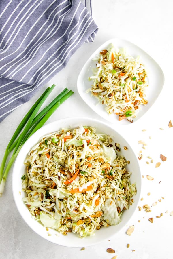 This easy Ramen Salad is a delicious side dish full of toasted almonds, sunflower seeds and topped with a tasty vinegar dressing! Easy Ramen Salad overhead view in bowl.