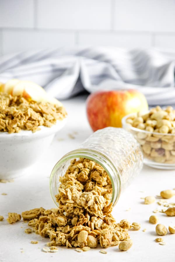 This easy Peanut Butter Granola snack is so delicious, you will be making it over and over again! Packed with peanut butter flavor! Peanut Butter Granola in glass jar