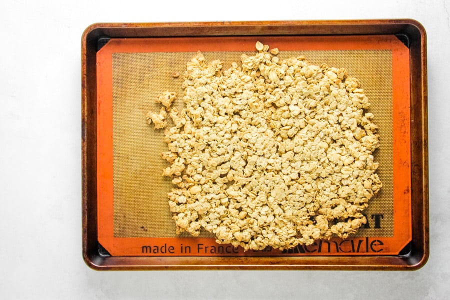 cooked granola on sheet pan.
