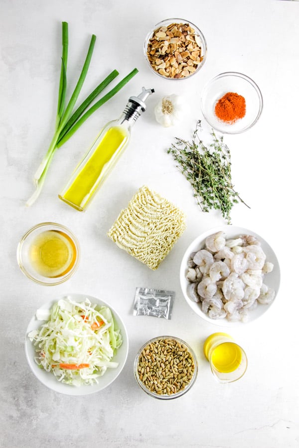Delicious, but simple Shrimp Ramen Salad! With spicy shrimp, toasted almonds, sunflower seeds and a shrimp flavored dressing! ingredients for Shrimp Ramen Salad.