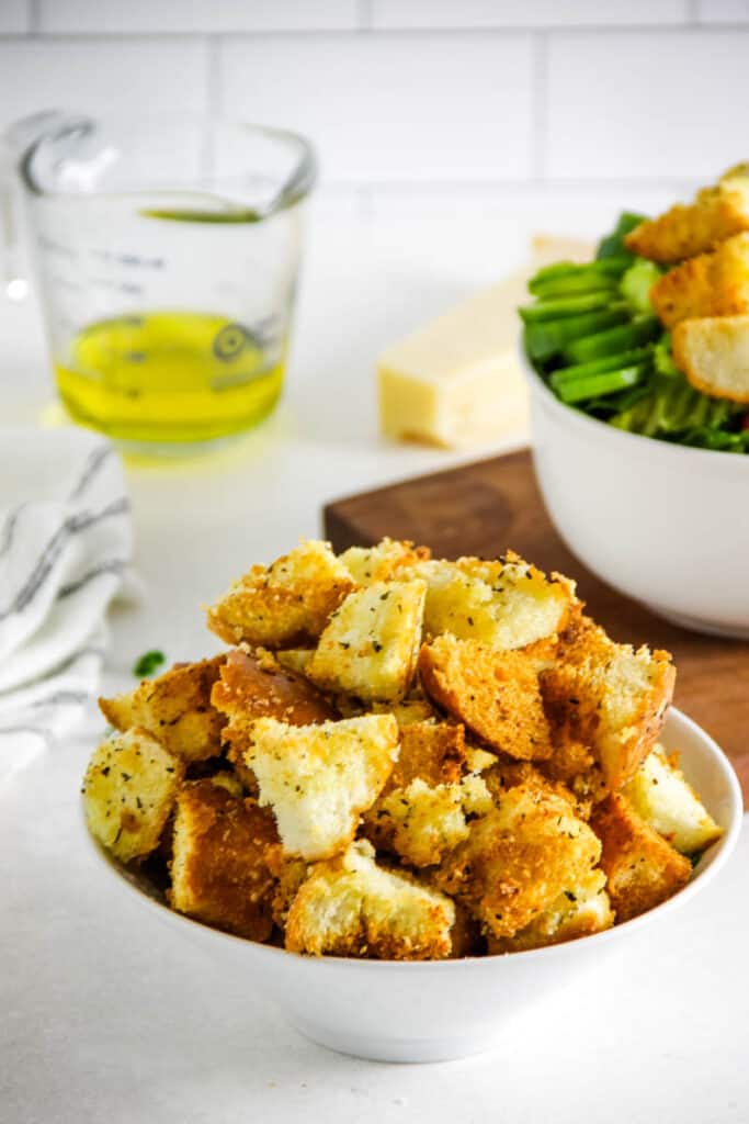 These Air Fryer Croutons are the perfect addition to salads or soups! Made with breads, spices and freshly grated Parmesan cheese! croutons in bowl.