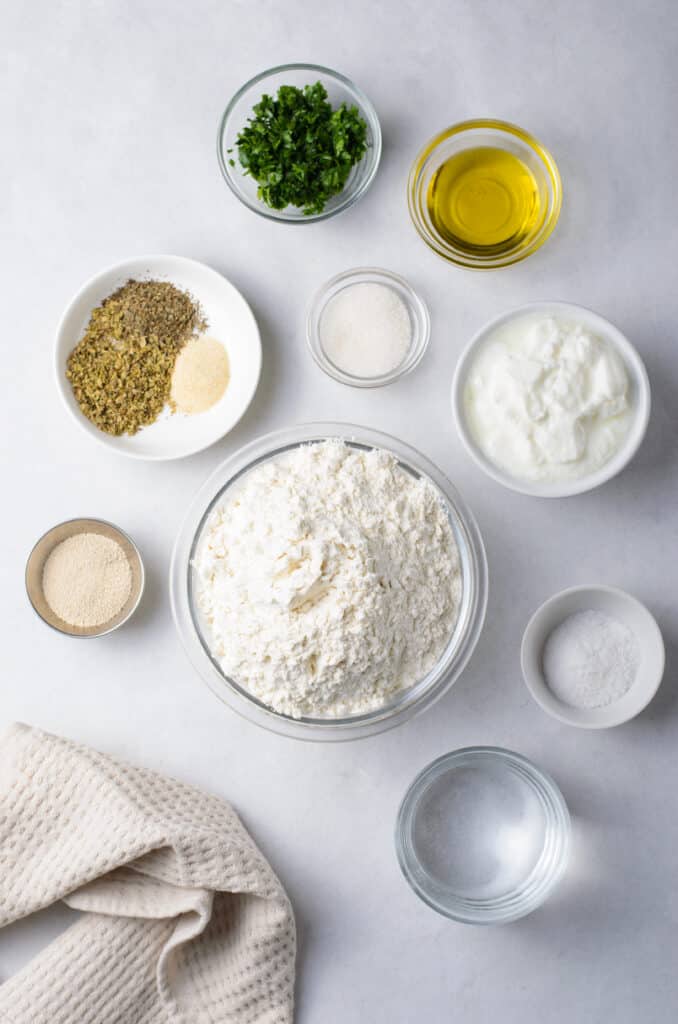 Easy Homemade Flatbread will be the only flatbread you will ever need! flatbread ingredients in glass bowls.