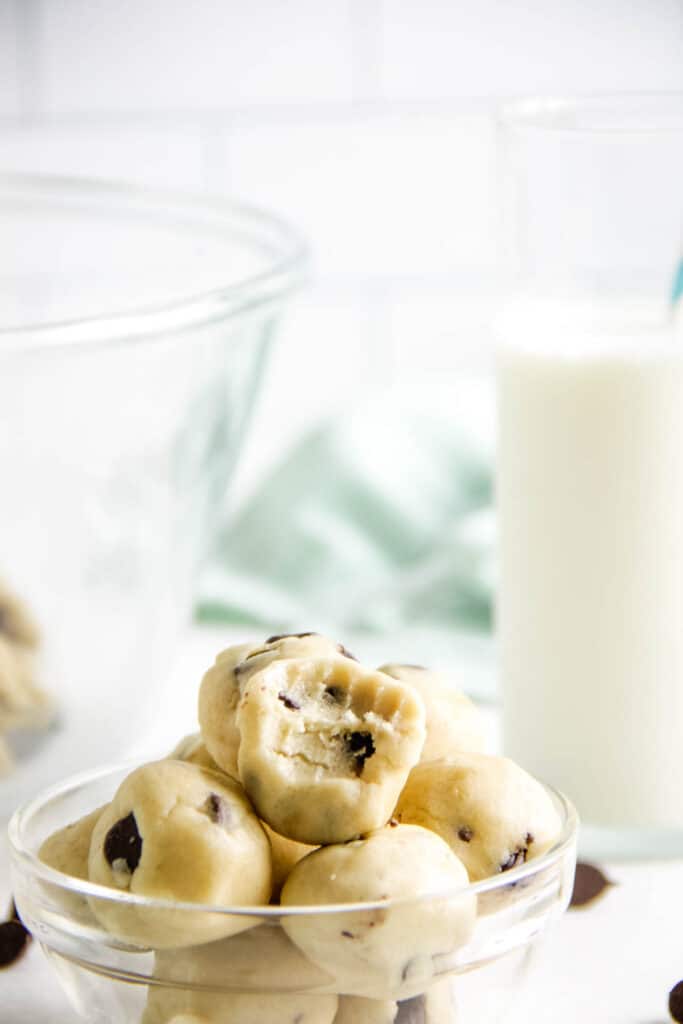These easy no bake Cookie Dough Bites are made with a few simple ingredients! They are rolled into balls, eaten with a spoon or can be frozen! close up of Cookie Dough Bites.