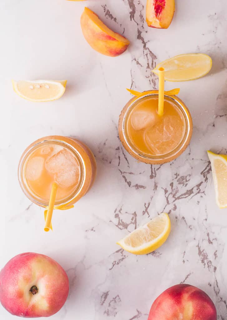 This simple, refreshing Peach Black Tea Lemonade has the perfect blend of flavors and just a touch of sweetness! Perfect for hot summer days! Peach Black Tea Lemonade overhead view.