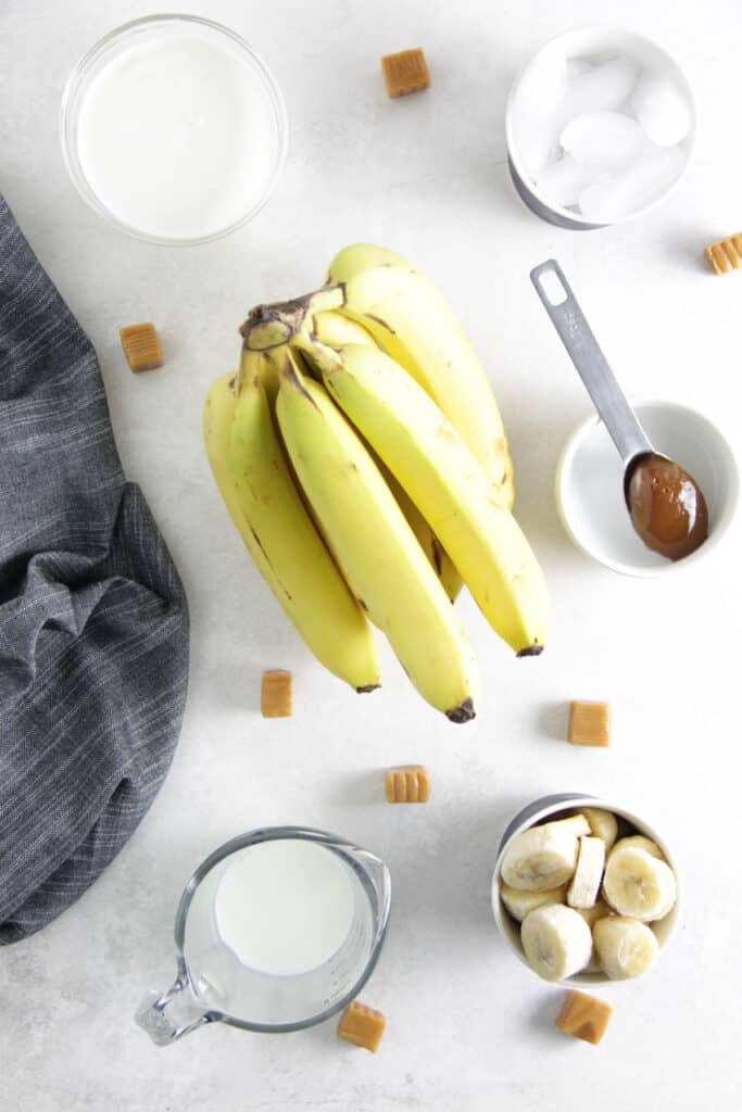 Banana Caramel Smoothie is fresh and creamy! Made with just 5 ingredient, this smoothie will help you power through the day! ingredients in bowls.