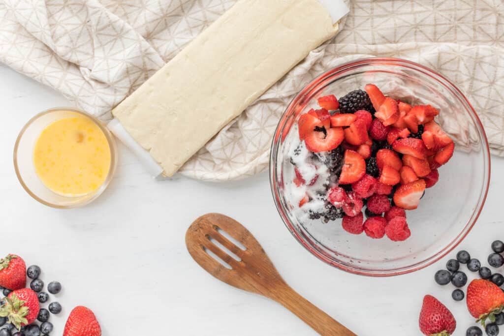 berries in bowl with sugar.