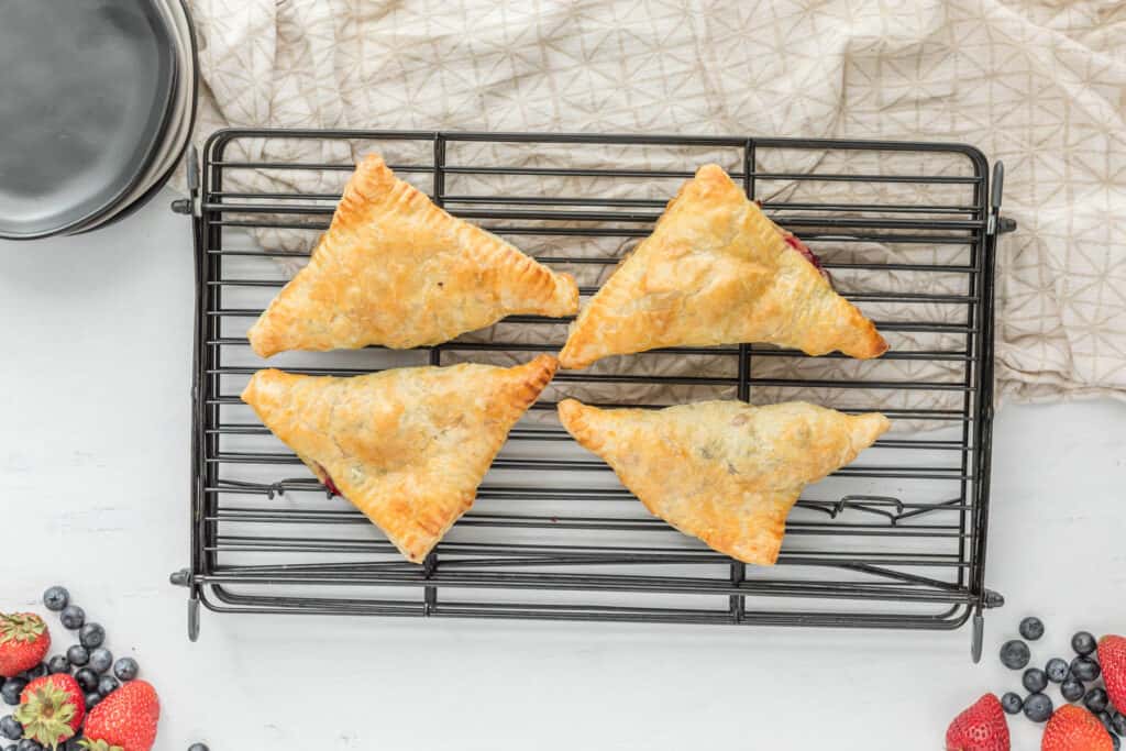 cooked turnovers on tray.
