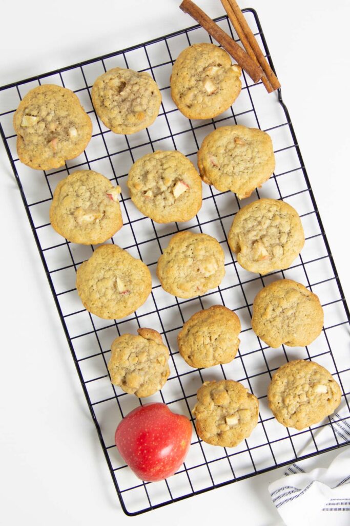 Using my basic cookie recipe these Apple Cinnamon Oatmeal Cookies have a fall twist to them! With lots of apples and cinnamon flavor! Apple Cinnamon Oatmeal Cookies on cooling rack.