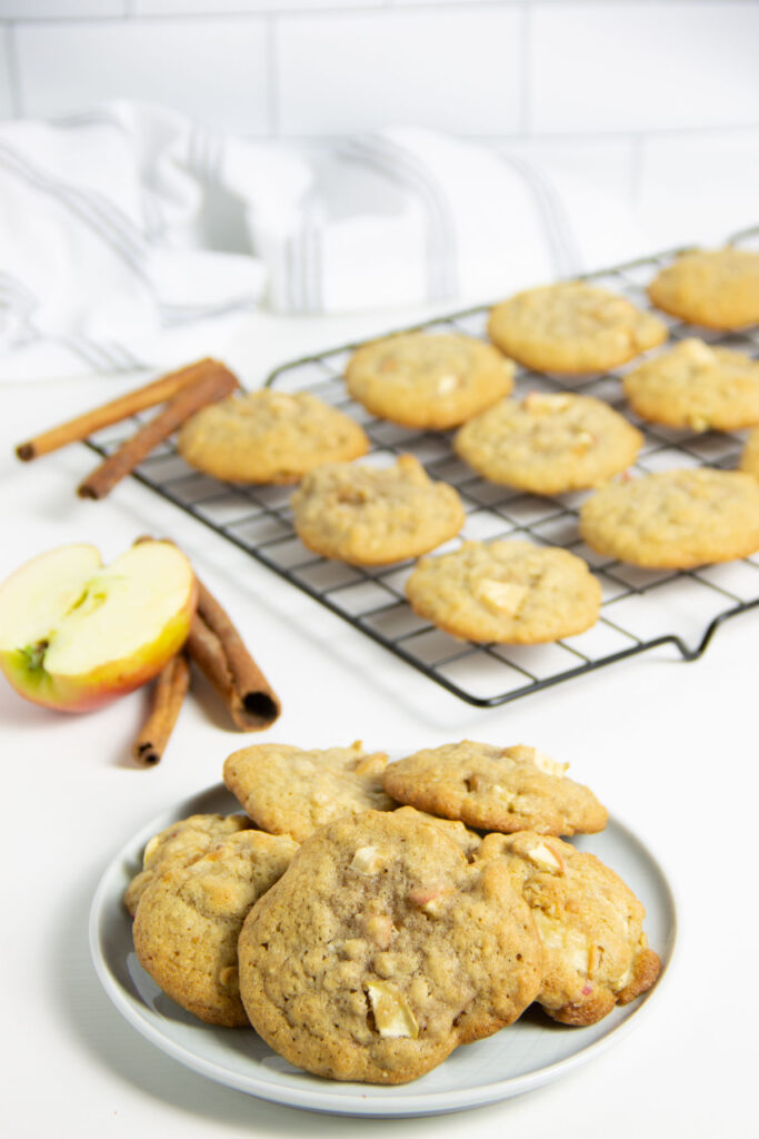 Using my basic cookie recipe these Apple Cinnamon Oatmeal Cookies have a fall twist to them! With lots of apples and cinnamon flavor! Apple Cinnamon Oatmeal Cookies on plate.