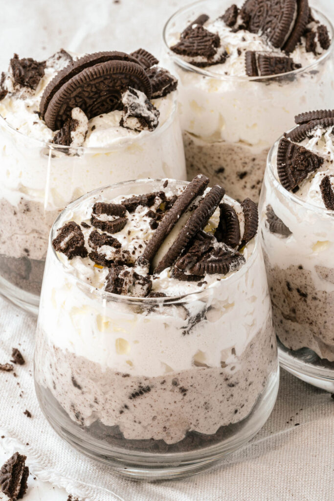 This easy Cookies and Cream Mousse is the perfect no bake dessert! Made with just 3 ingredients, it comes together quickly! Cookies and Cream Mousse in glass serving dish.