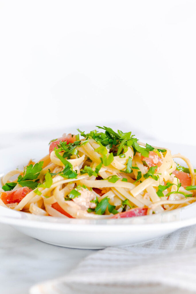 This easy Tuna Pasta With Tomatoes is perfect for a quick meal! With fresh tomatoes and parsley, this pasta can easily be modified! Tuna Pasta with Tomato in bowl.