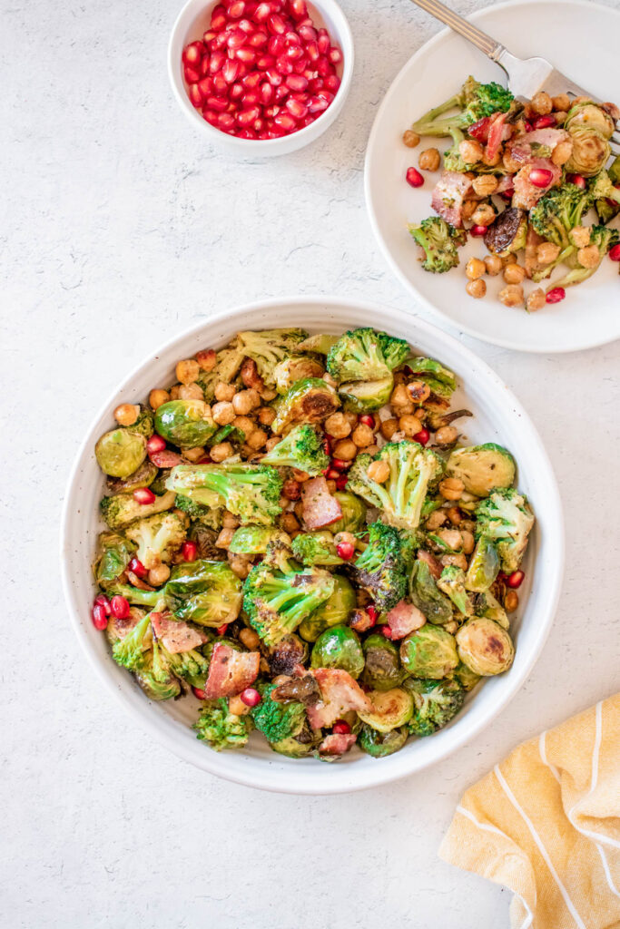 This Warm Brussels Sprouts Salad with Bacon, chickpeas and broccoli that is topped with an apple cider dijon dressing!
