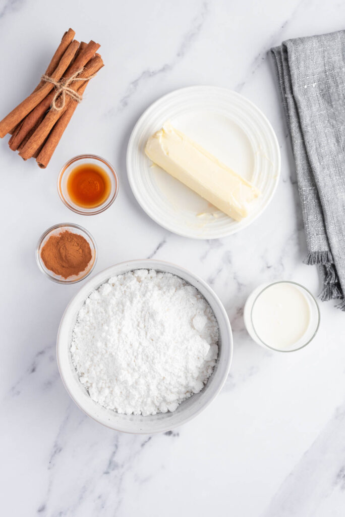 Cinnamon Buttercream Frosting! ingredients on white background.