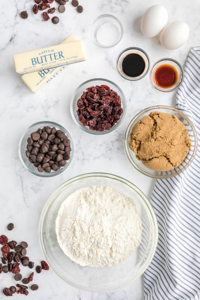 Soft, buttery Dark Chocolate Chip Cherry Cookies! Flavored with a touch of almond extract and lots of dark chocolate! Dark Chocolate Chip Cherry Cookies ingredients in bowls.