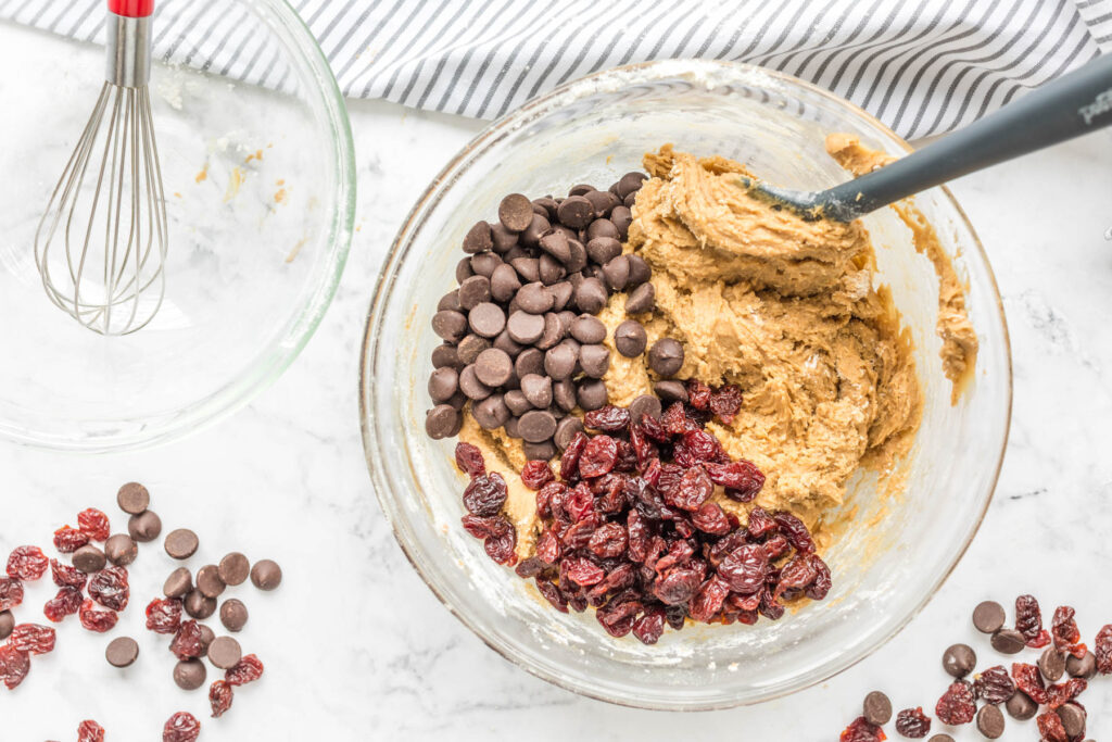 chocolate chips and cherries in glass bowl.