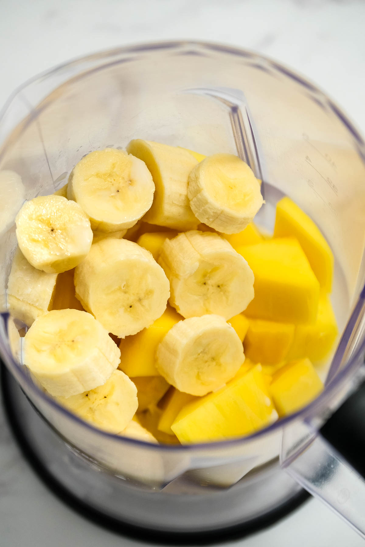 banana and mango in blender.