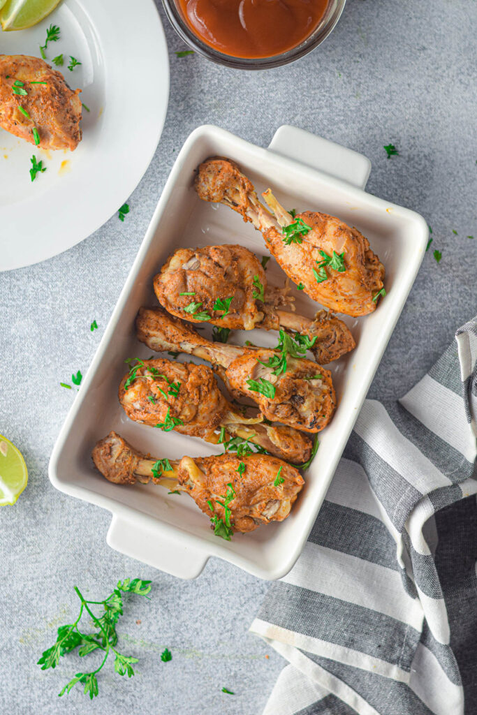 Instant Pot Chicken Drumsticks are so juicy and tender and can be made in no time. Perfectly seasoned and cooked to perfection Instant Pot Chicken Drumsticks on gray background.