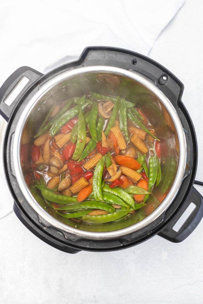 Easy Instant Pot Vegetable Stir Fry filled with hearty vegetables, covered in a sweet and savory sauce. cooked stir fry in instant pot.