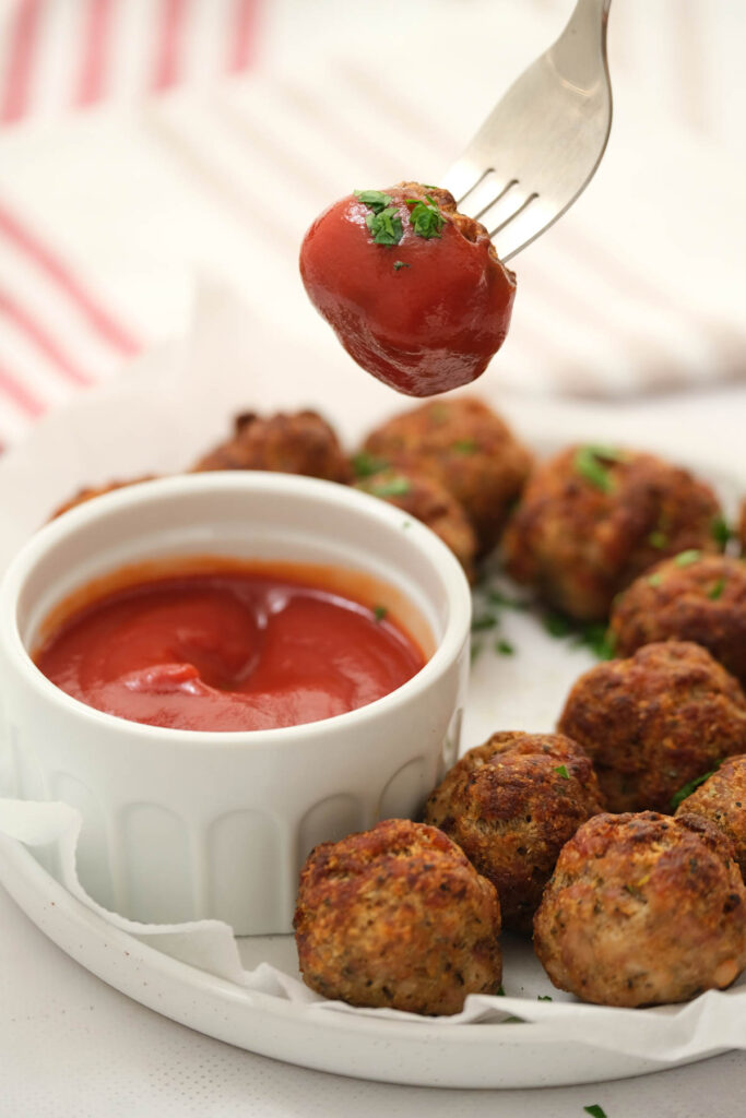 Air Fryer Turkey Meatballs are simple to make and baking up in 20 minutes! Air Fryer Turkey Meatballs dipped in sauce.