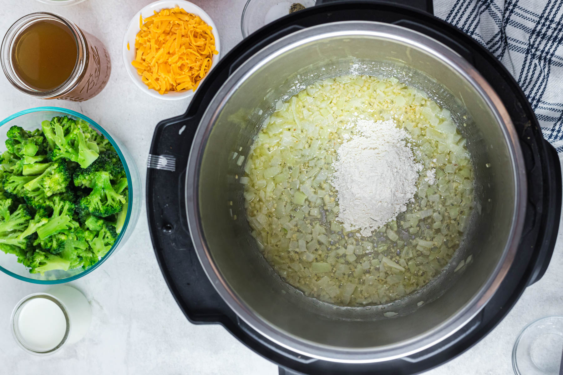 add flour to instant pot with cooked onions.