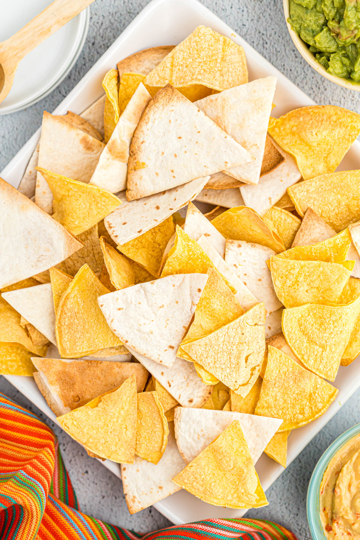 These Air Fryer Tortilla Chips made two ways! Using flour or corn tortilla chips, you can have freshly cooked chips in just minutes! overhead view of tortilla chips