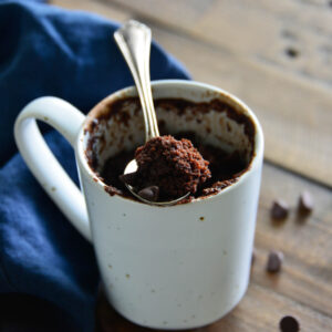 chocolate cake in cup with spoon.