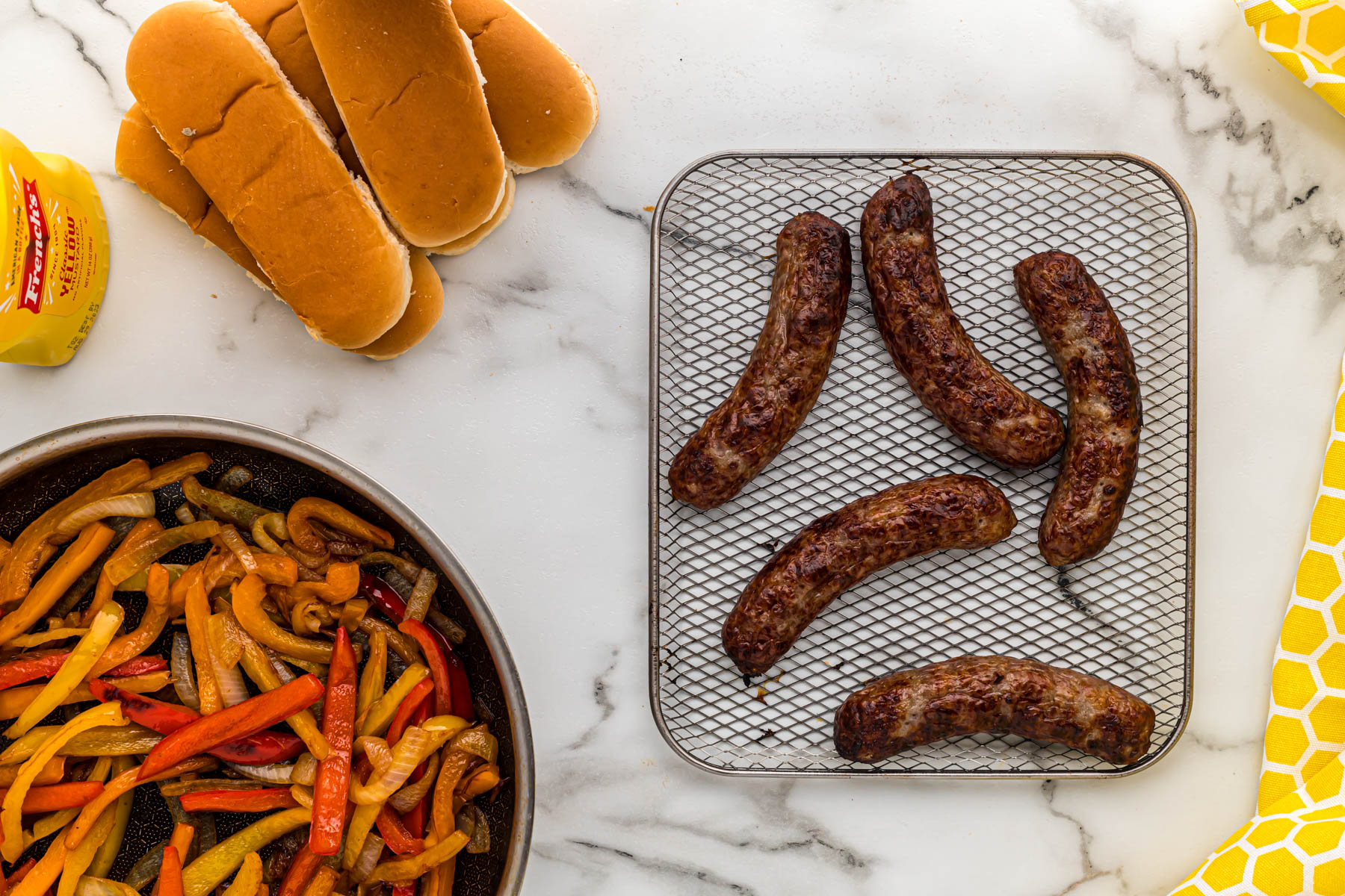 cooked bratwurst on tray.